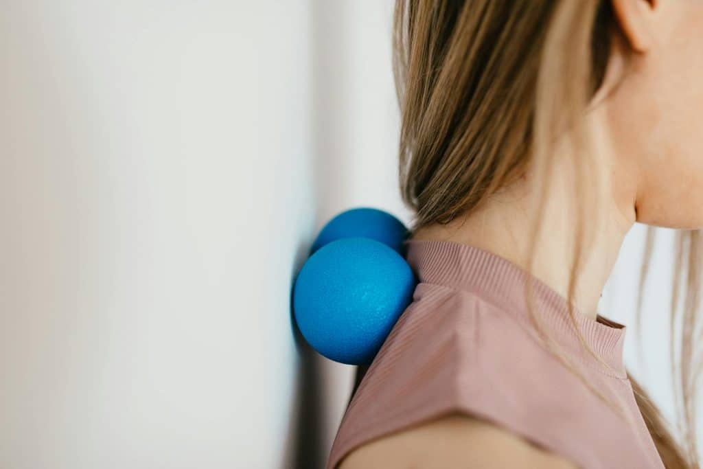 woman releasing trigger points and neck tension