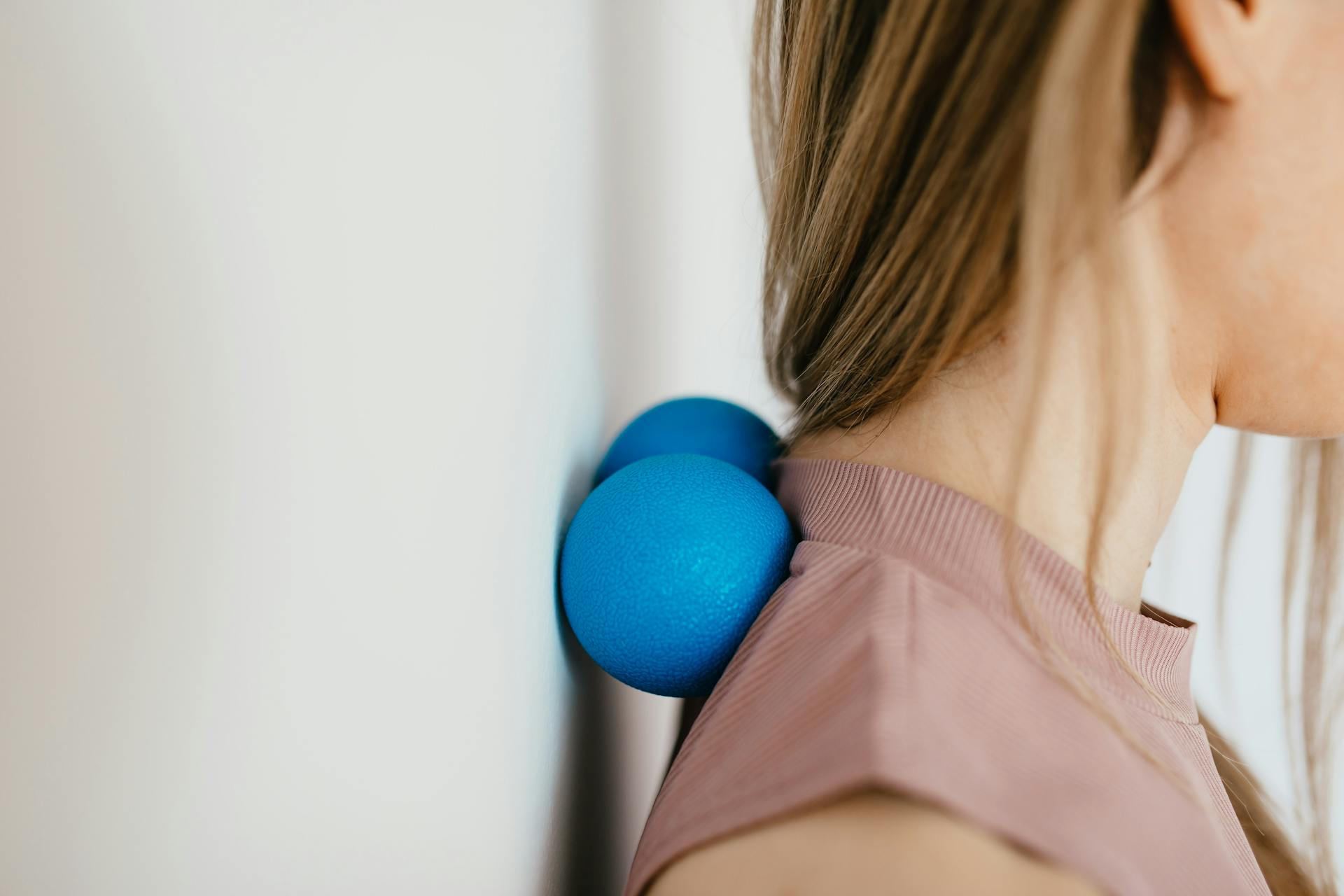 woman releasing trigger points and neck tension