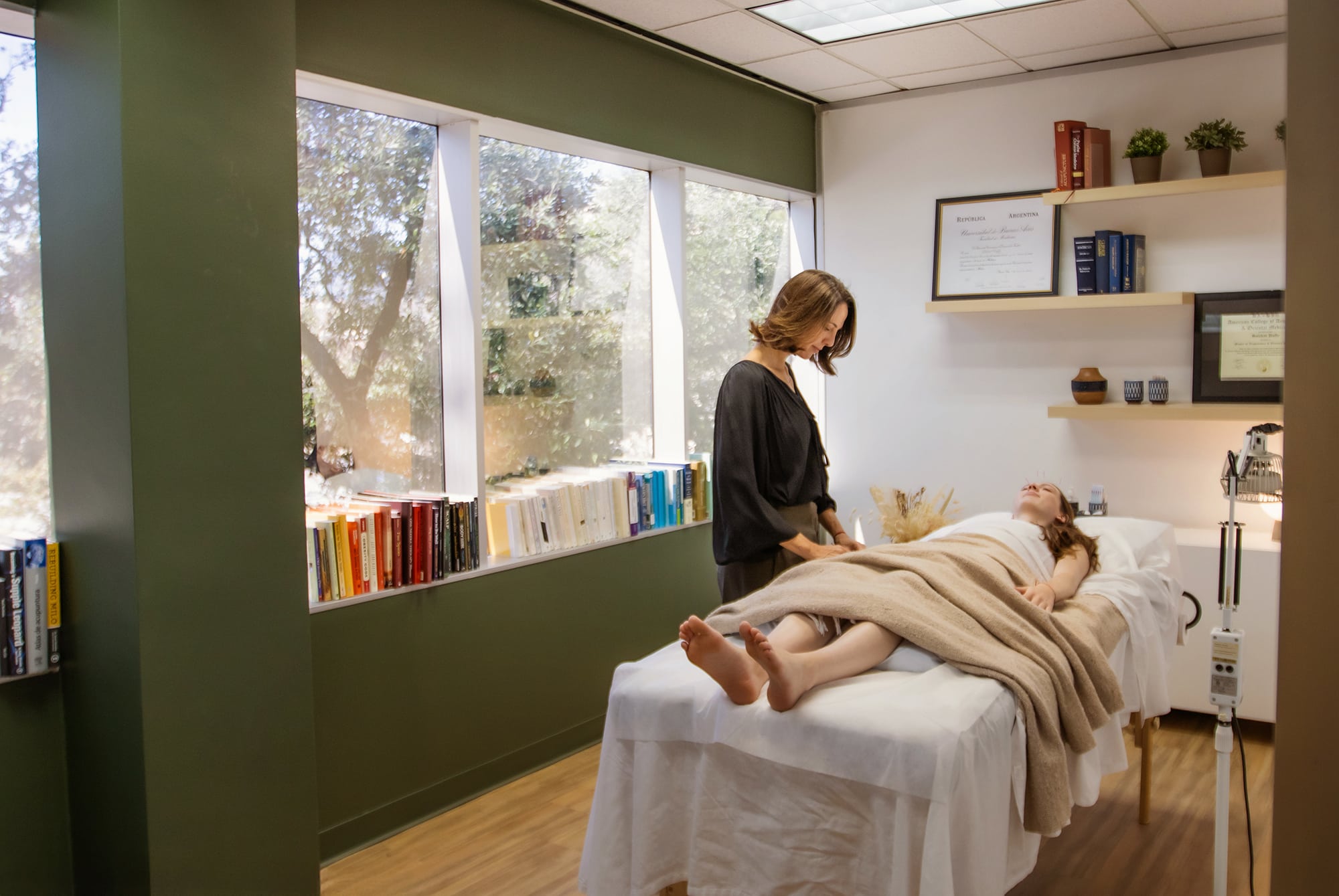 Therapist performing treatment in relaxing room